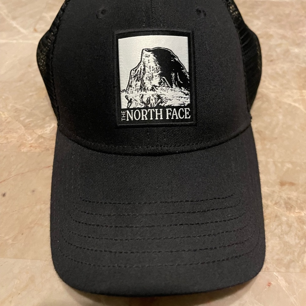 The Northface cap black with black mesh adjustable snap closure